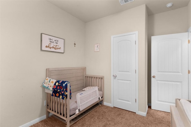 bedroom featuring carpet flooring and baseboards