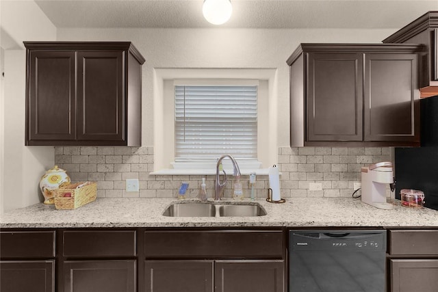 kitchen featuring black dishwasher, a sink, dark brown cabinetry, and backsplash