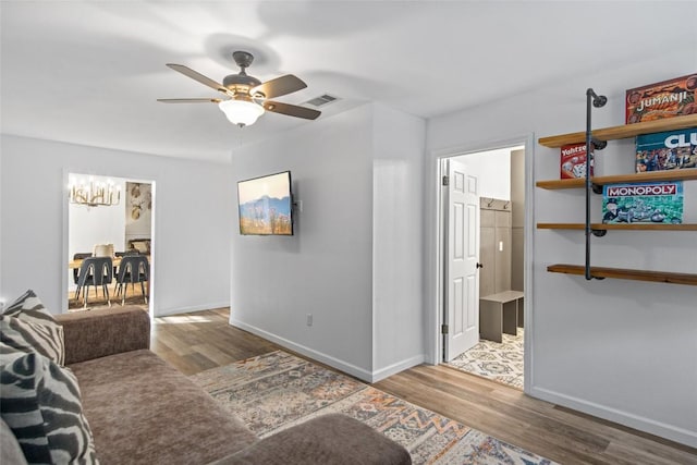 701 W Esparada Dr, Georgetown, TX 78628 - living room with wood finished floors, baseboards, and ceiling fan