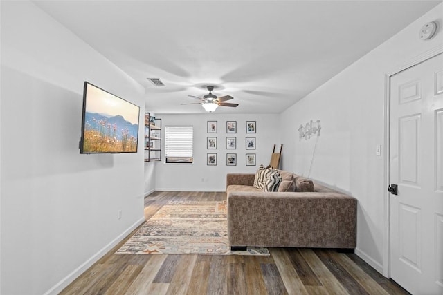 701 W Esparada Dr, Georgetown, TX 78628 - living area with a ceiling fan, wood finished floors, and baseboards