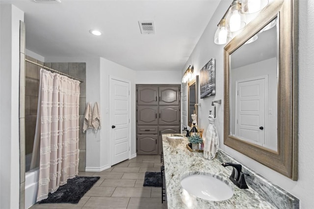 701 W Esparada Dr, Georgetown, TX 78628 - full bathroom featuring shower / bath combo with shower curtain, double vanity, baseboards, and recessed lighting