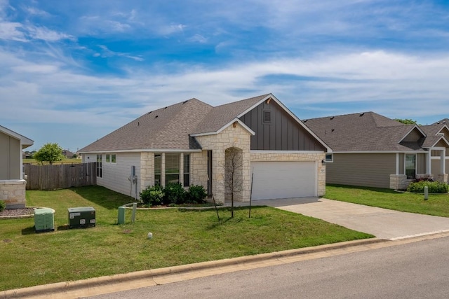 7317 Buffalo Grass Dr, Temple, TX 76502 - view of front of house with stone siding, board and batten siding, driveway, a garage, and a shingled roof