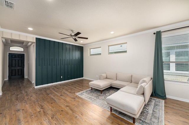 7317 Buffalo Grass Dr, Temple, TX 76502 - living area featuring ornamental molding, baseboards, ceiling fan, wood finished floors, and recessed lighting