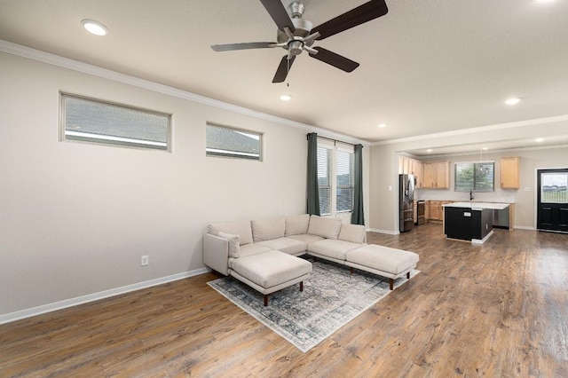 7317 Buffalo Grass Dr, Temple, TX 76502 - living room with ornamental molding, a ceiling fan, baseboards, wood finished floors, and recessed lighting