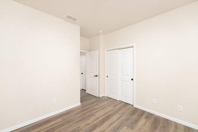 7317 Buffalo Grass Dr, Temple, TX 76502 - unfurnished bedroom with wood finished floors, baseboards, and a closet