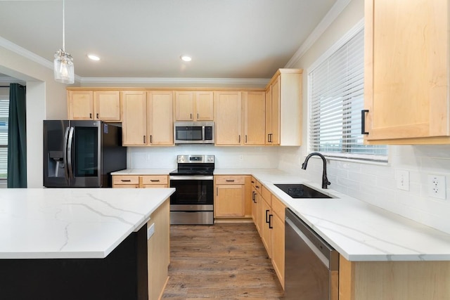 7317 Buffalo Grass Dr, Temple, TX 76502 - kitchen featuring stainless steel appliances, light brown cabinets, a sink, ornamental molding, and tasteful backsplash