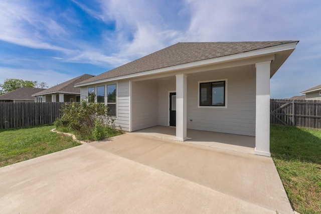 7317 Buffalo Grass Dr, Temple, TX 76502 - back of property with a patio and roof with shingles