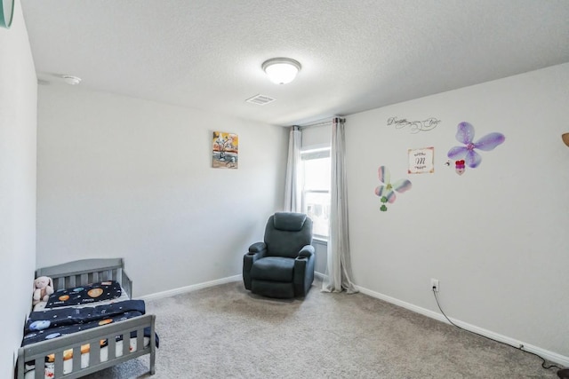 12003 Corsicana Trl, Manor, TX 78653 - living area with carpet floors, a textured ceiling, and baseboards