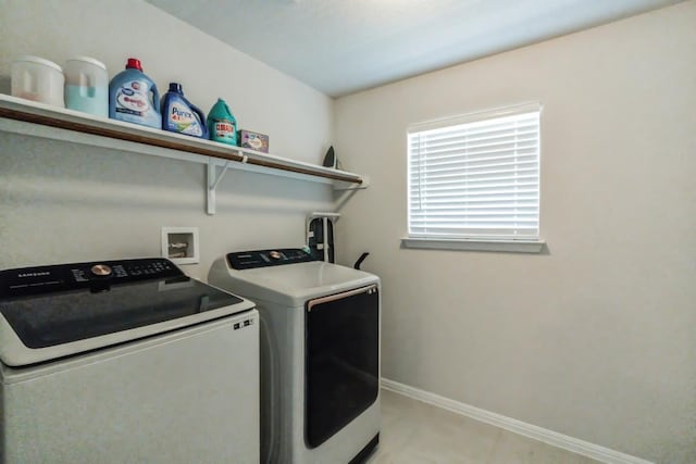 12003 Corsicana Trl, Manor, TX 78653 - washroom featuring washer and clothes dryer and baseboards