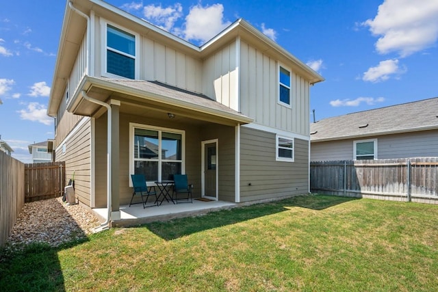 12003 Corsicana Trl, Manor, TX 78653 - back of house featuring board and batten siding and a patio area