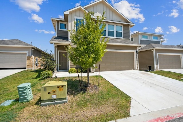 12003 Corsicana Trl, Manor, TX 78653 - view of front of house featuring board and batten siding, driveway, a front lawn, and an attached garage