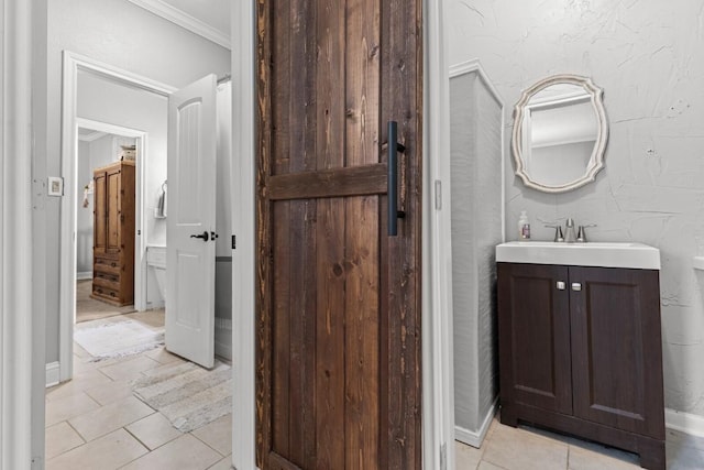 131 Norm St, China Spring, TX 76633 - bathroom with tile patterned flooring, crown molding, vanity, and baseboards