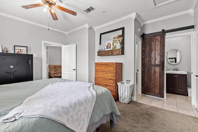 131 Norm St, China Spring, TX 76633 - bedroom featuring light carpet, ornamental molding, light tile patterned floors, a sink, and a barn door