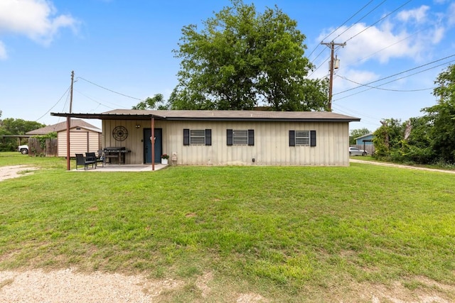 131 Norm St, China Spring, TX 76633 - view of front of house with board and batten siding, a patio, and a front yard
