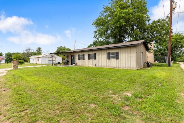 131 Norm St, China Spring, TX 76633 - ranch-style house featuring board and batten siding, a front lawn, a patio, and cooling unit