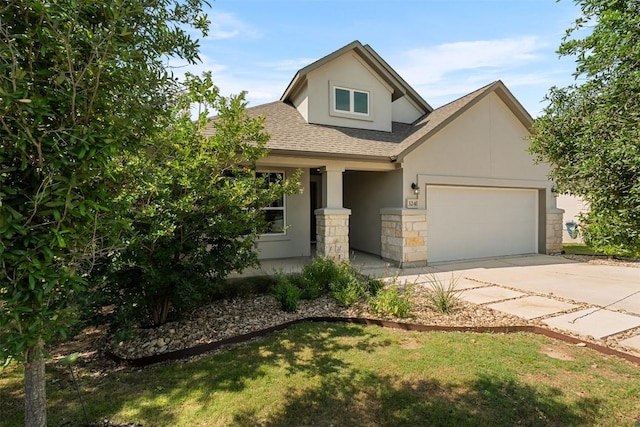 324 Pisa Ln, Georgetown, TX 78628 - view of front of house featuring stucco siding, a shingled roof, an attached garage, driveway, and stone siding