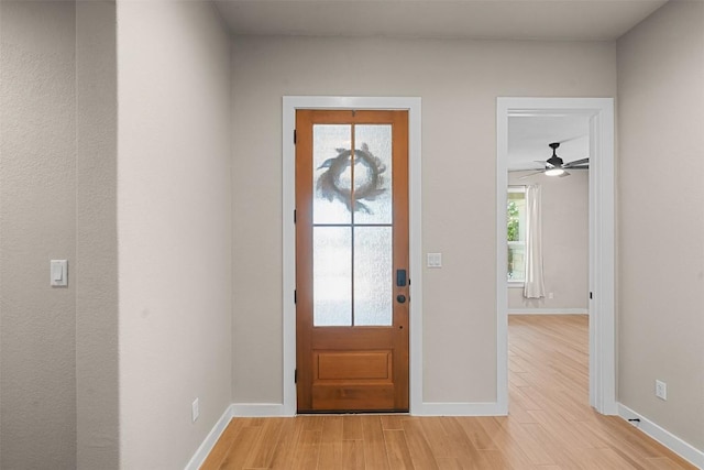 324 Pisa Ln, Georgetown, TX 78628 - foyer entrance with light wood-type flooring, baseboards, and ceiling fan