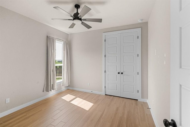 324 Pisa Ln, Georgetown, TX 78628 - unfurnished bedroom with light wood finished floors, baseboards, a closet, and ceiling fan