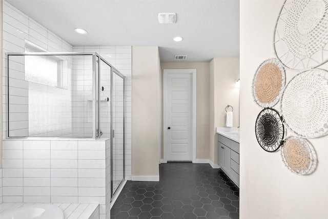 324 Pisa Ln, Georgetown, TX 78628 - full bathroom with a shower stall, vanity, baseboards, tile patterned floors, and recessed lighting