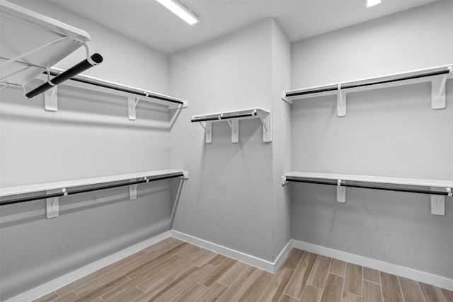 324 Pisa Ln, Georgetown, TX 78628 - spacious closet with wood finished floors