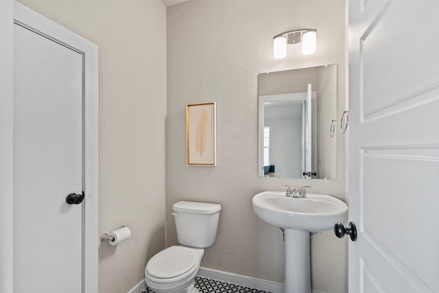 324 Pisa Ln, Georgetown, TX 78628 - bathroom featuring toilet and baseboards
