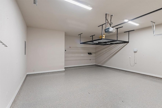 324 Pisa Ln, Georgetown, TX 78628 - garage with a garage door opener and baseboards