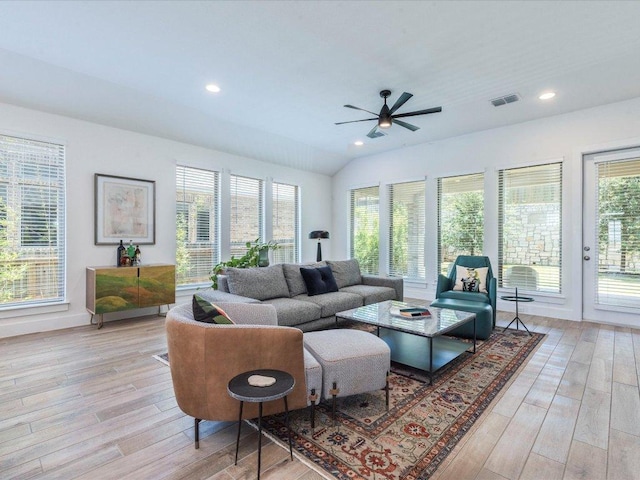 living area featuring ceiling fan, light wood-style floors, plenty of natural light, recessed lighting, and vaulted ceiling