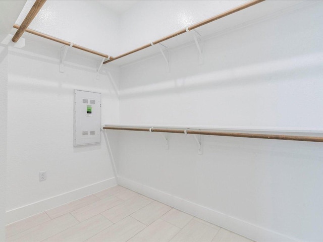 walk in closet featuring electric panel