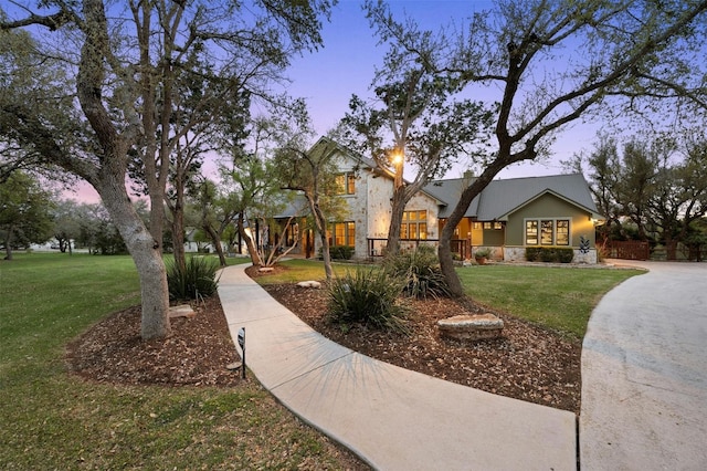 12316 Triple Creek Dr, Dripping Springs, TX 78620 - view of front of property featuring a front yard and stone siding