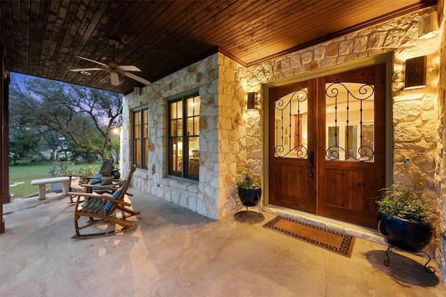 12316 Triple Creek Dr, Dripping Springs, TX 78620 - entrance to property featuring stone siding and a ceiling fan