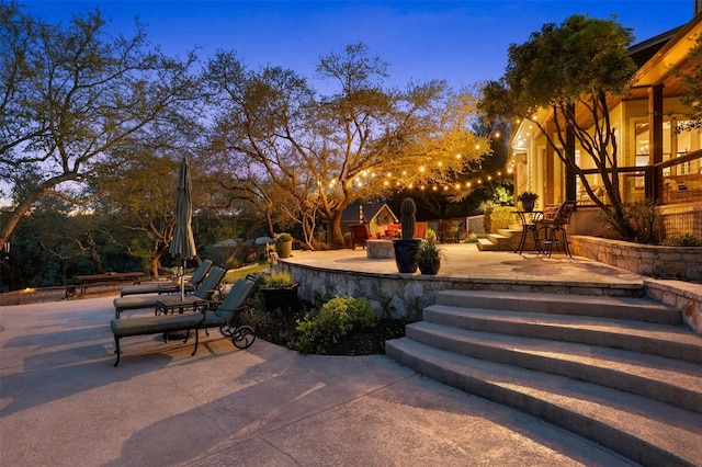 12316 Triple Creek Dr, Dripping Springs, TX 78620 - patio terrace at dusk featuring a patio