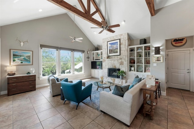 12316 Triple Creek Dr, Dripping Springs, TX 78620 - tiled living room featuring high vaulted ceiling, beamed ceiling, a stone fireplace, baseboards, and ceiling fan