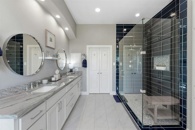 12316 Triple Creek Dr, Dripping Springs, TX 78620 - bathroom with double vanity, a stall shower, recessed lighting, and marble look tiles