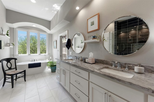 12316 Triple Creek Dr, Dripping Springs, TX 78620 - full bath featuring double vanity, a soaking tub, a stall shower, and recessed lighting