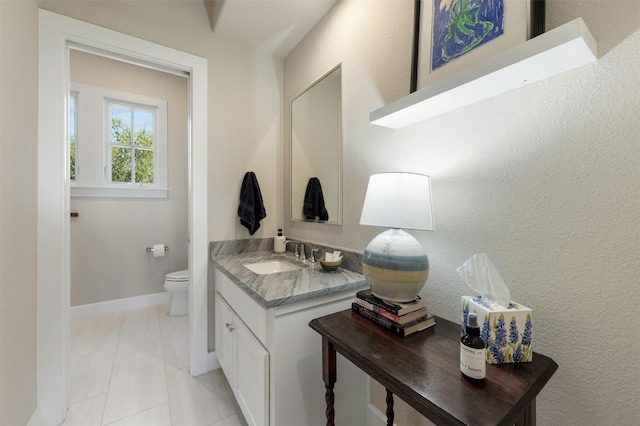 12316 Triple Creek Dr, Dripping Springs, TX 78620 - bathroom featuring vanity, toilet, and baseboards
