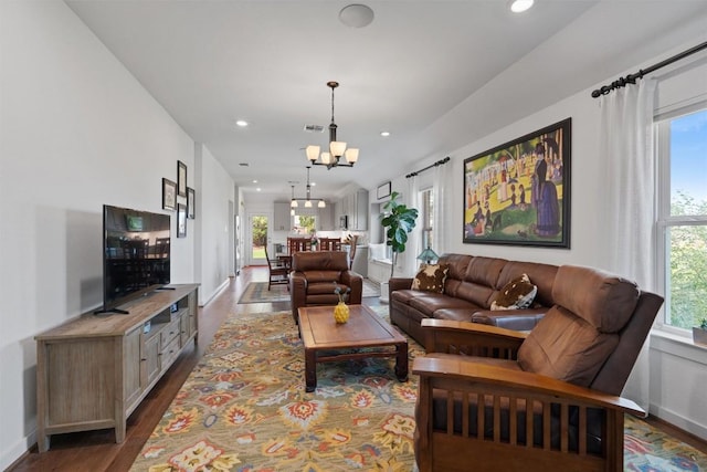 300 Gidran Trl, Georgetown, TX 78626 - living area with dark wood finished floors, a chandelier, plenty of natural light, recessed lighting, and baseboards