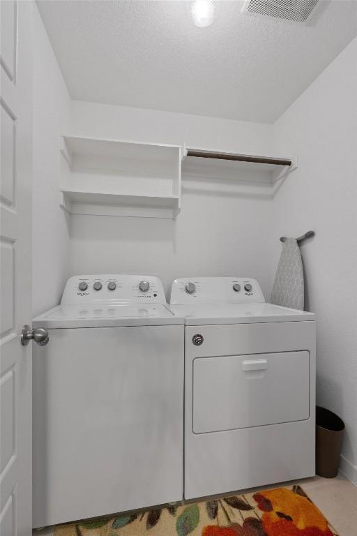 laundry room featuring washer and dryer