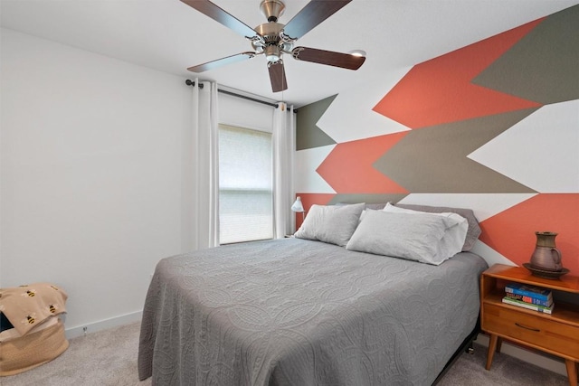 bedroom featuring carpet floors, a ceiling fan, and baseboards