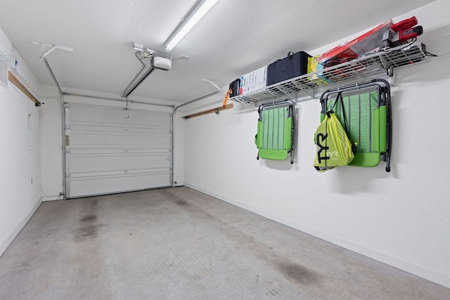 3105 Aldwyche Dr, Austin, TX 78704 - garage featuring baseboards and a garage door opener
