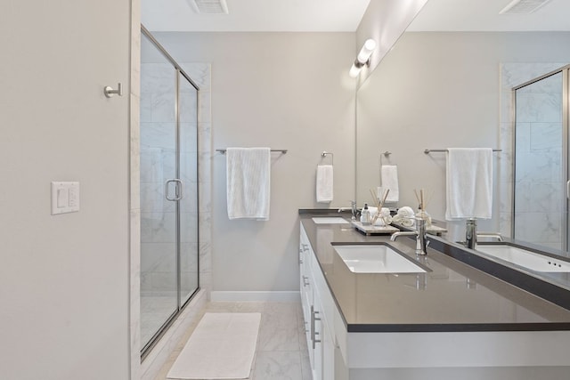 3105 Aldwyche Dr, Austin, TX 78704 - bathroom with a stall shower, marble look tiles, double vanity, and baseboards