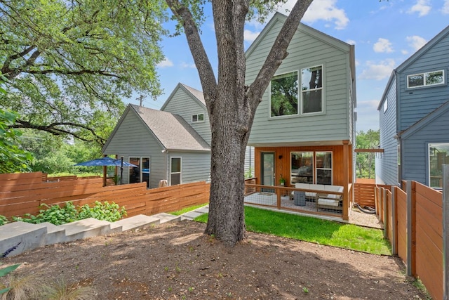 3105 Aldwyche Dr, Austin, TX 78704 - rear view of house with a fenced backyard, board and batten siding, and a patio