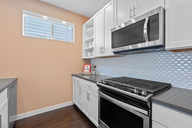 3105 Aldwyche Dr, Austin, TX 78704 - kitchen with appliances with stainless steel finishes, dark countertops, baseboards, and tasteful backsplash