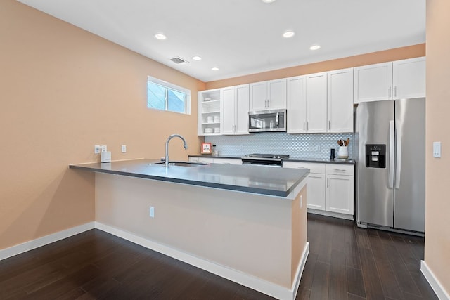 3105 Aldwyche Dr, Austin, TX 78704 - kitchen featuring stainless steel appliances, a sink, decorative backsplash, dark wood-style floors, and a peninsula