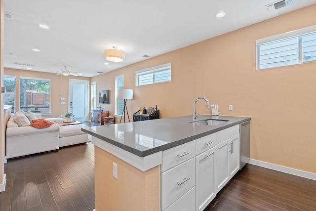 3105 Aldwyche Dr, Austin, TX 78704 - kitchen featuring a sink, stainless steel dishwasher, dark countertops, plenty of natural light, and recessed lighting