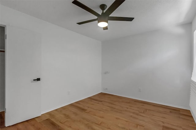 8800 Dandelion Trl, Austin, TX 78745 - spare room with ceiling fan, light wood-style flooring, and baseboards