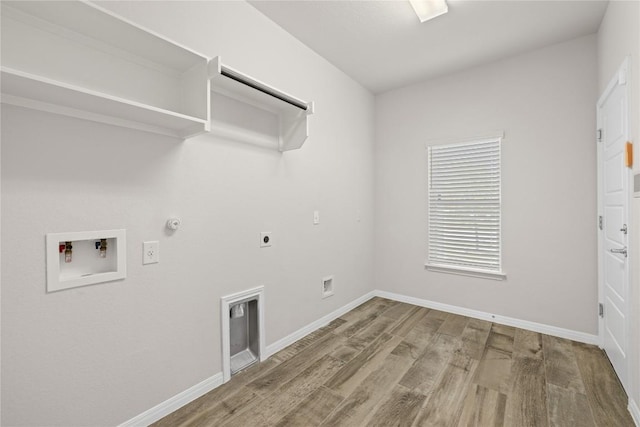 5213 Fresno Ave, Pflugerville, TX 78660 - laundry area featuring gas dryer hookup, hookup for an electric dryer, washer hookup, and wood finished floors