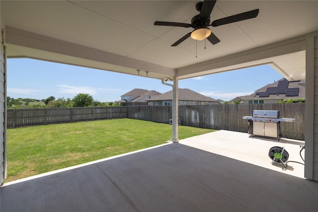 5213 Fresno Ave, Pflugerville, TX 78660 - fenced backyard featuring a patio area, a ceiling fan, and area for grilling
