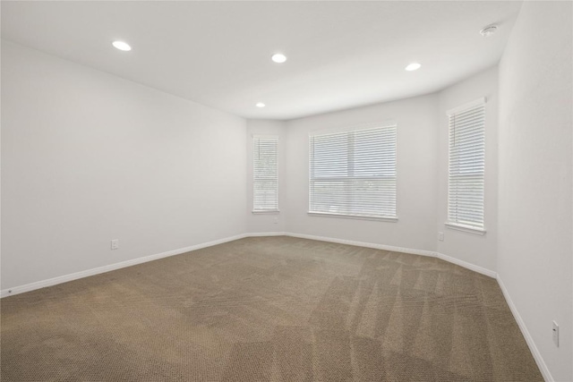 5213 Fresno Ave, Pflugerville, TX 78660 - carpeted empty room featuring recessed lighting and a smoke detector