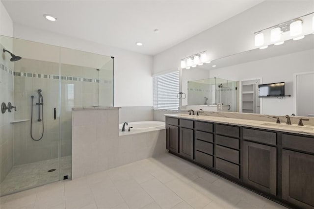 5213 Fresno Ave, Pflugerville, TX 78660 - full bath featuring a shower stall, a bath, double vanity, tile patterned flooring, and recessed lighting