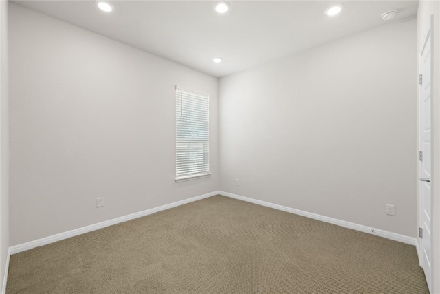 5213 Fresno Ave, Pflugerville, TX 78660 - spare room featuring carpet floors, recessed lighting, and a smoke detector